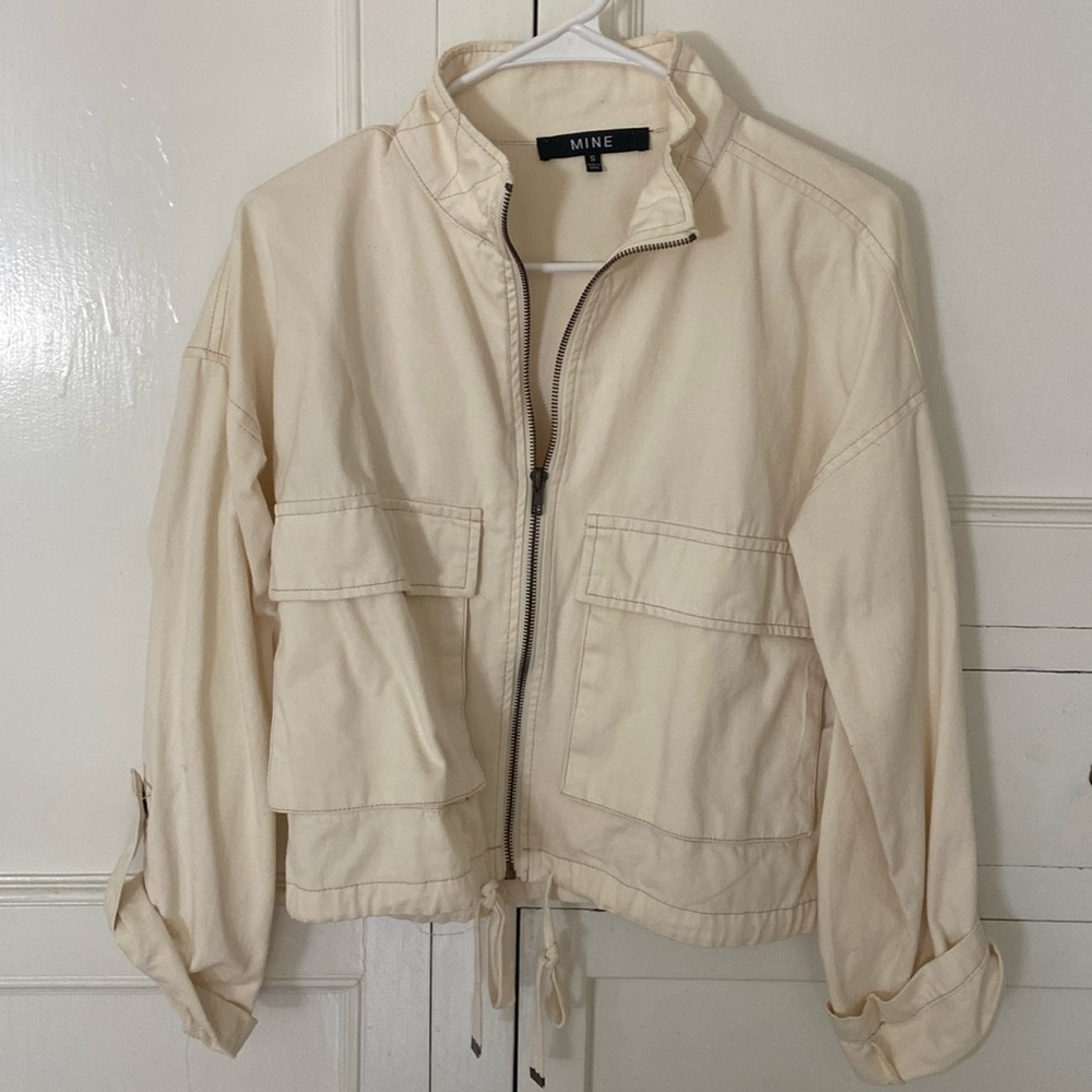 cream jacket, cargo pockets